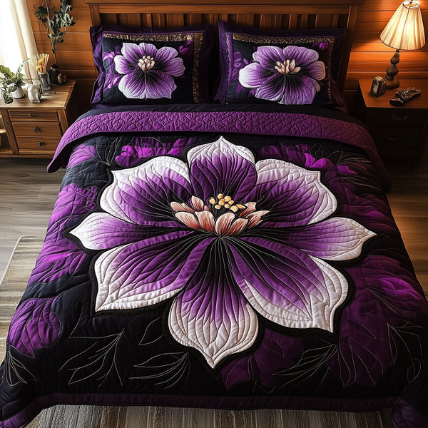 Dark Purple Flower quilted 3-piece bedding set on a made bed with two matching pillow shams