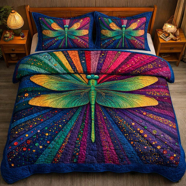 Cosmic Dragonfly quilted 3-piece bedding set on a made bed with two matching pillow shams