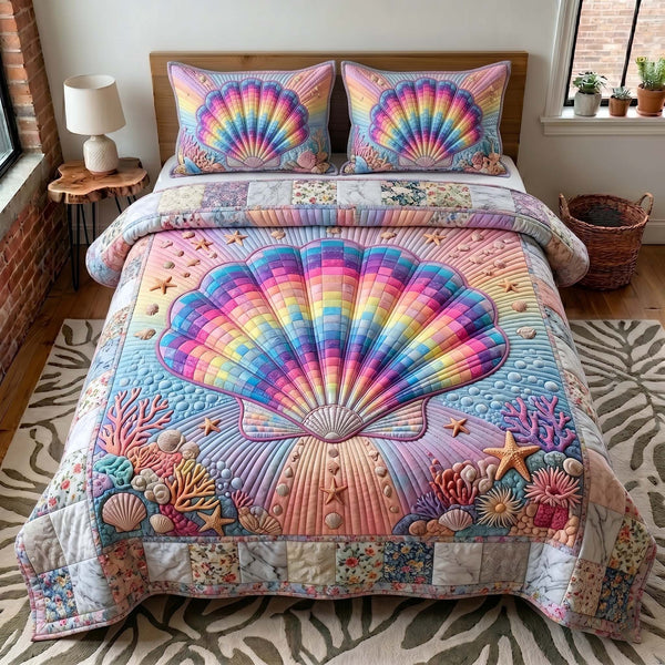 Coastal Whisper quilted 3-piece bedding set on a made bed in a light coastal bedroom