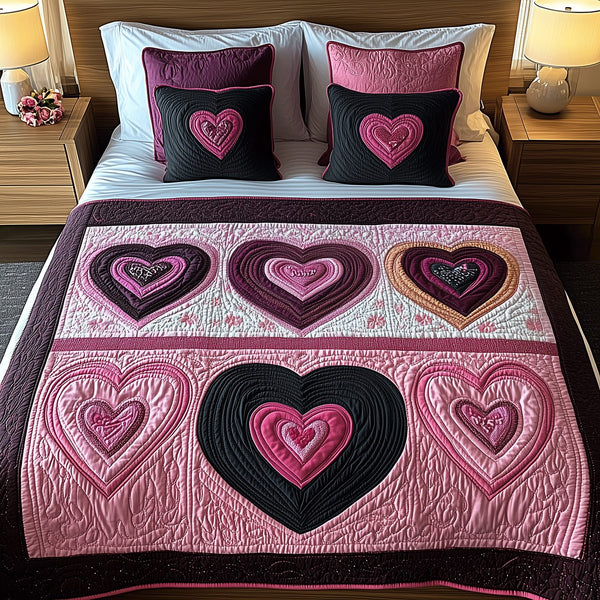 Adoring Hearts quilted 3-piece bedding set on a made bed with two matching pillow shams