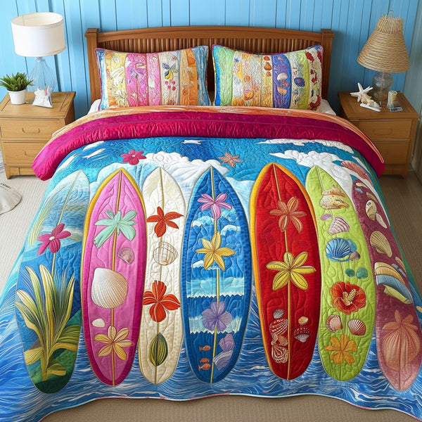 Aqua Bliss quilted 3-piece bedding set on a made bed with two matching pillow shams