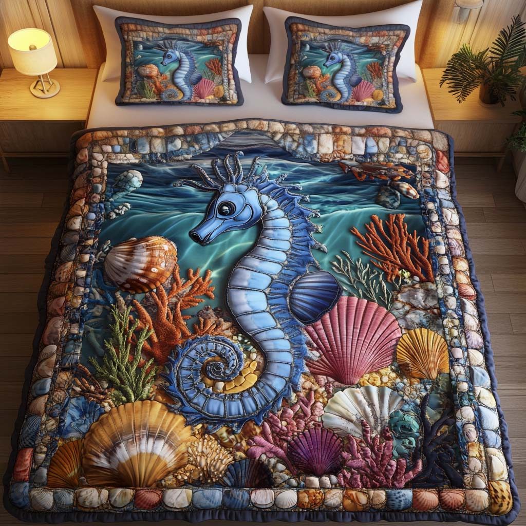 Aqua Haven quilted 3-piece bedding set on a made bed with two matching pillow shams