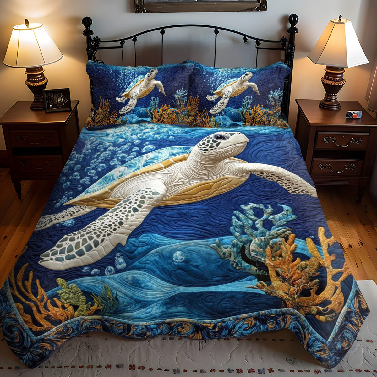 Aqua Traveler quilted 3-piece bedding set on a made bed with two matching pillow shams