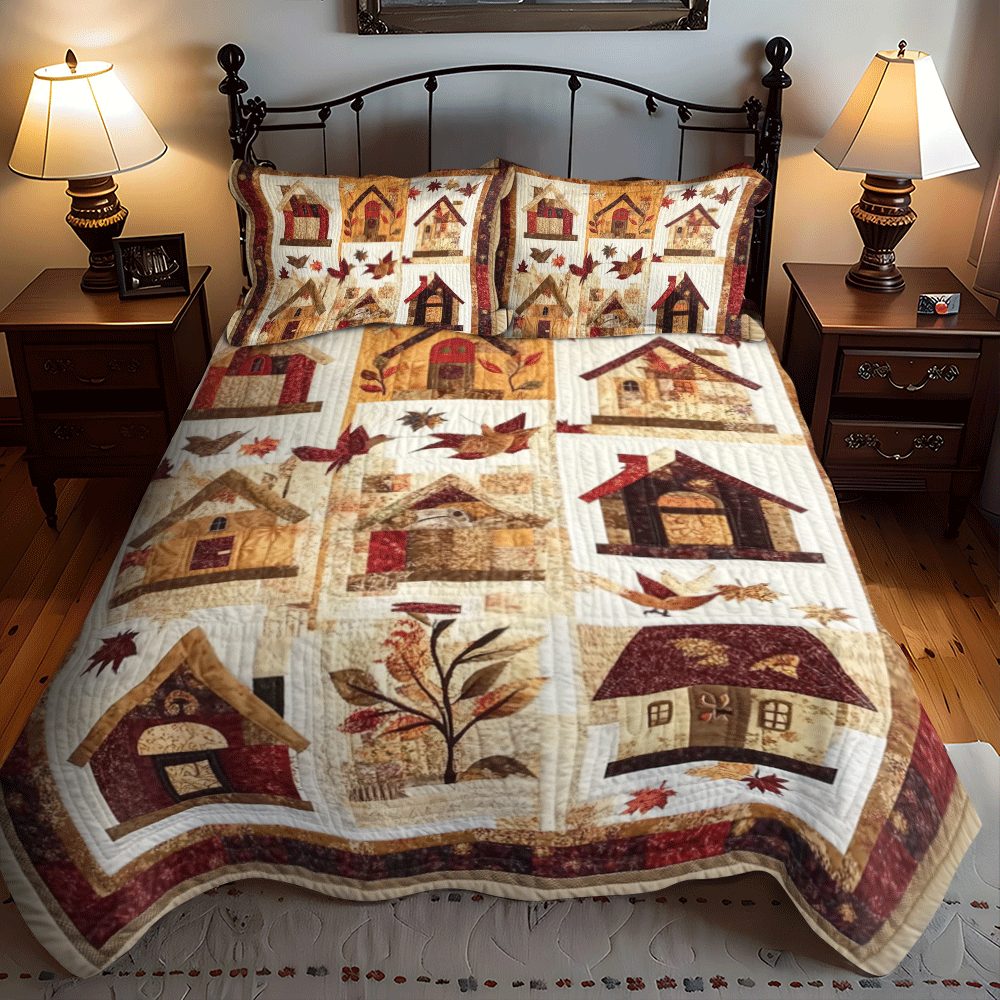 Autumn Bird House quilted 3-piece bedding set on a made bed with two matching pillow shams