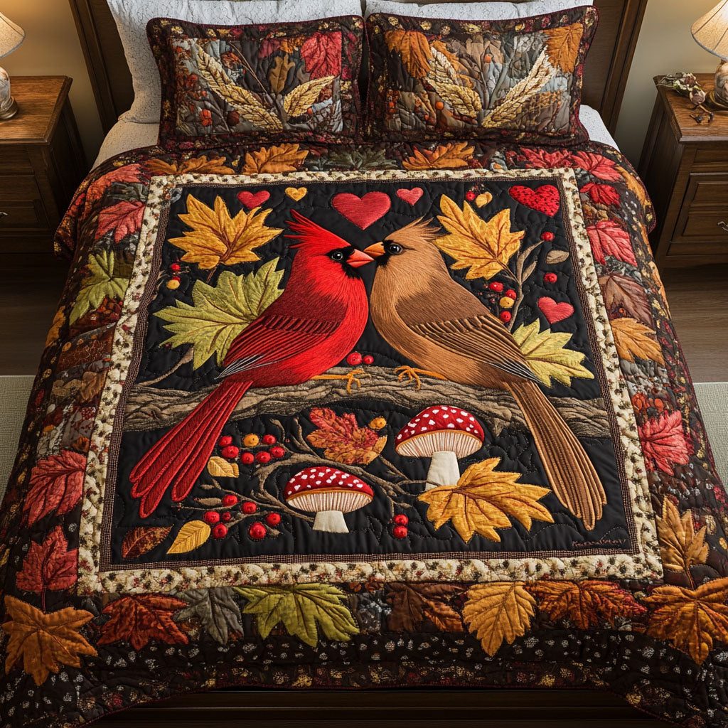 Autumn Cardinal Love quilted 3-piece bedding set on a made bed with two matching pillow shams