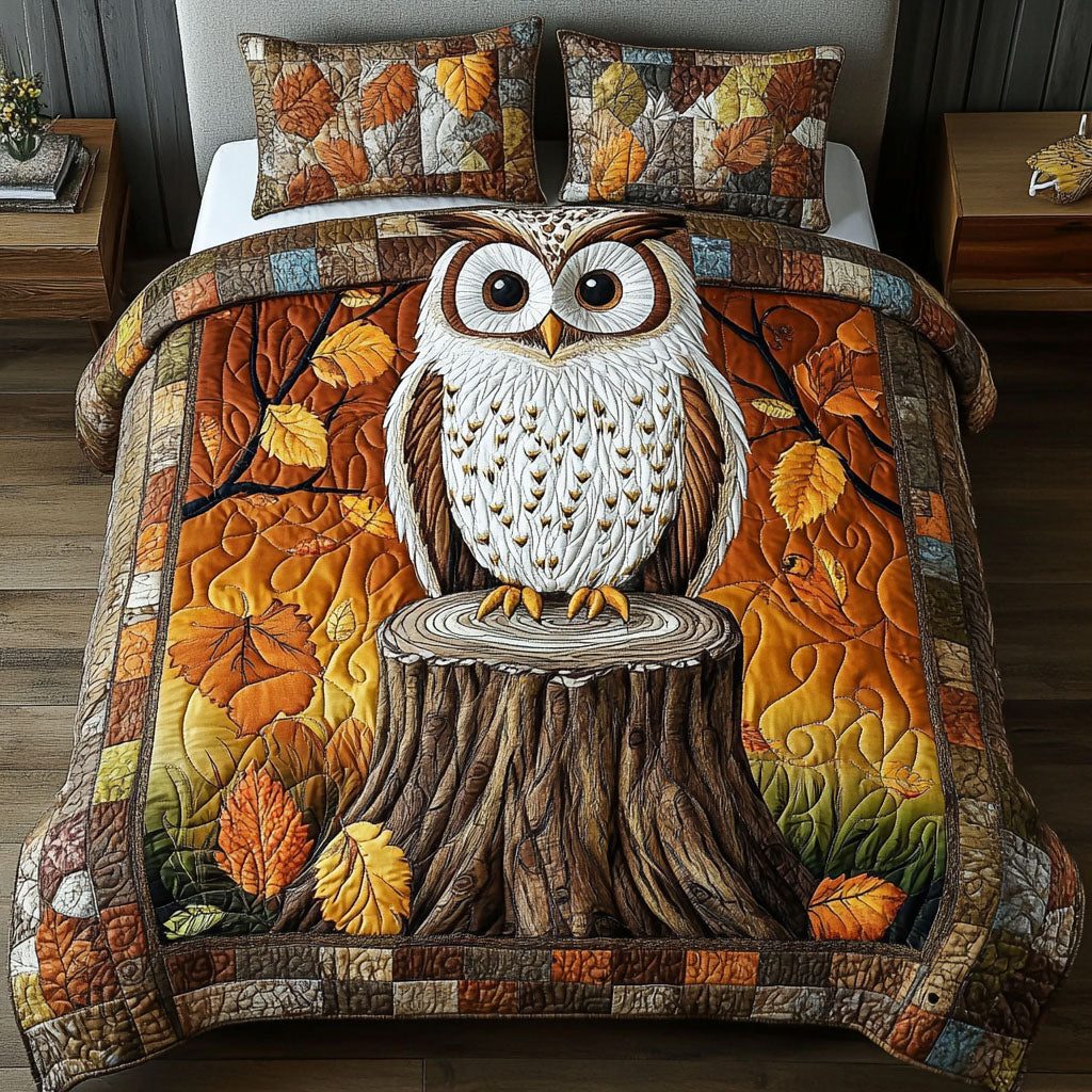 Autumn Perch quilted 3-piece bedding set on a made bed with two matching pillow shams