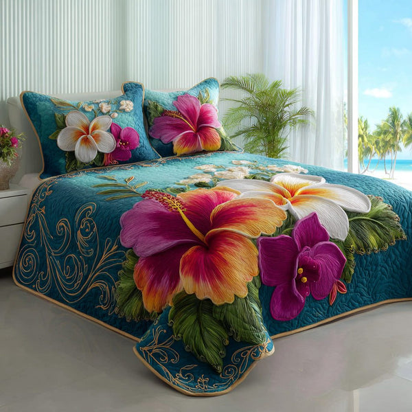 Azure Bloom quilted 3-piece bedding set on a made bed with two matching pillow shams