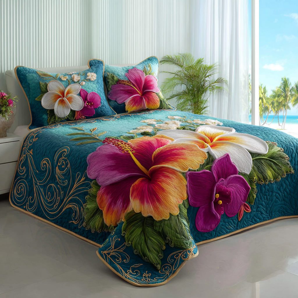 Azure Bloom quilted 3-piece bedding set on a made bed with two matching pillow shams
