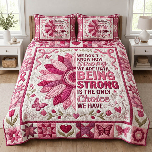 Being Strong quilted 3-piece bedding set on a made bed with two matching pillow shams