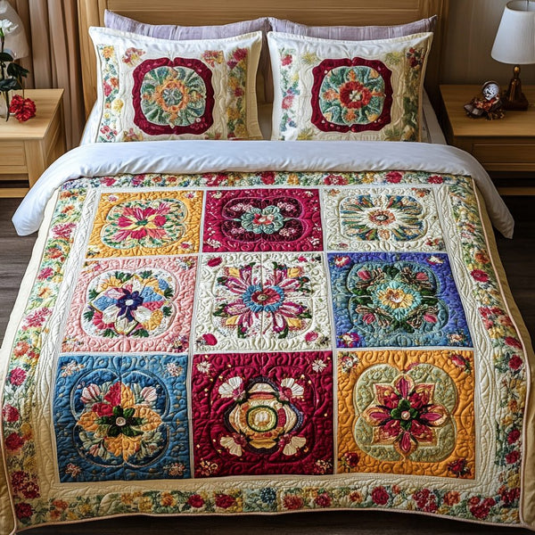 Bloom Haven quilted 3-piece bedding set on a made bed with two matching pillow shams