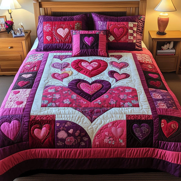 Blooming Hearts quilted 3-piece bedding set on a made bed with two matching pillow shams