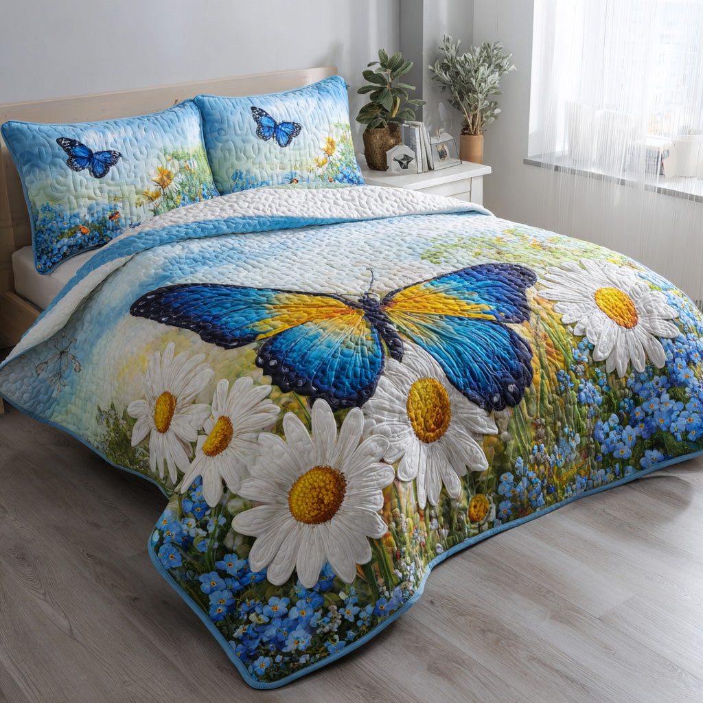 Blue Butterfly quilted 3-piece bedding set on a made bed with two matching pillow shams