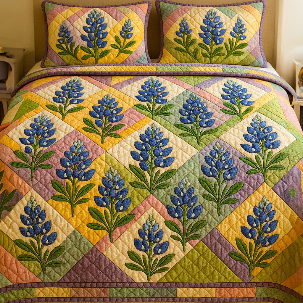 Bluebonnet Path quilted 3-piece bedding set on a made bed with two matching pillow shams