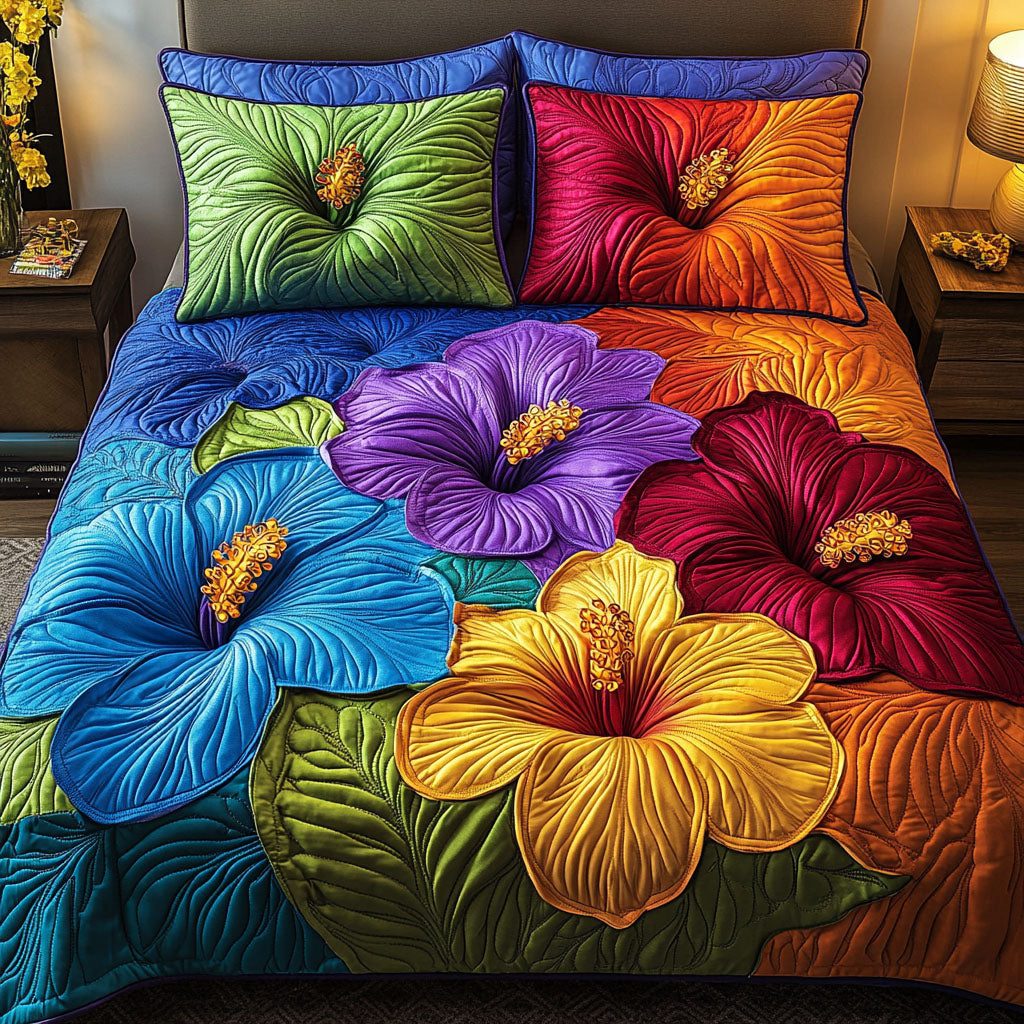 Bold Blossom Harmony quilted 3-piece bedding set on a made bed with two matching pillow shams