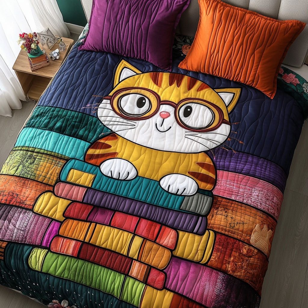 Bookstack Kitty quilted 3-piece bedding set on a made bed with two matching pillow shams