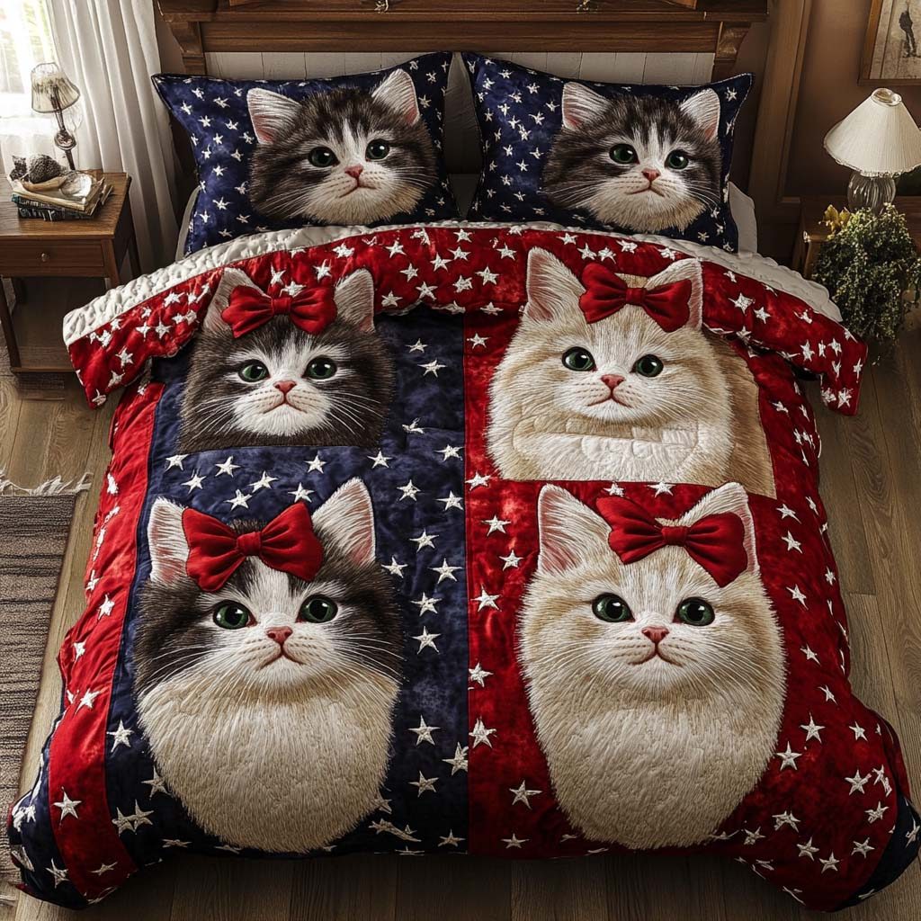 Bowtie Kittens quilted 3-piece bedding set on a made bed with two matching pillow shams
