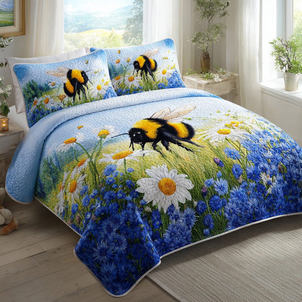 Bumblebee Blues quilted 3-piece bedding set on a made bed with two matching pillow shams