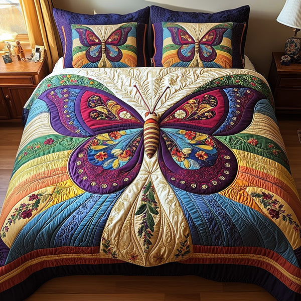 Butterfly Charm quilted 3-piece bedding set on a made bed with two matching pillow shams