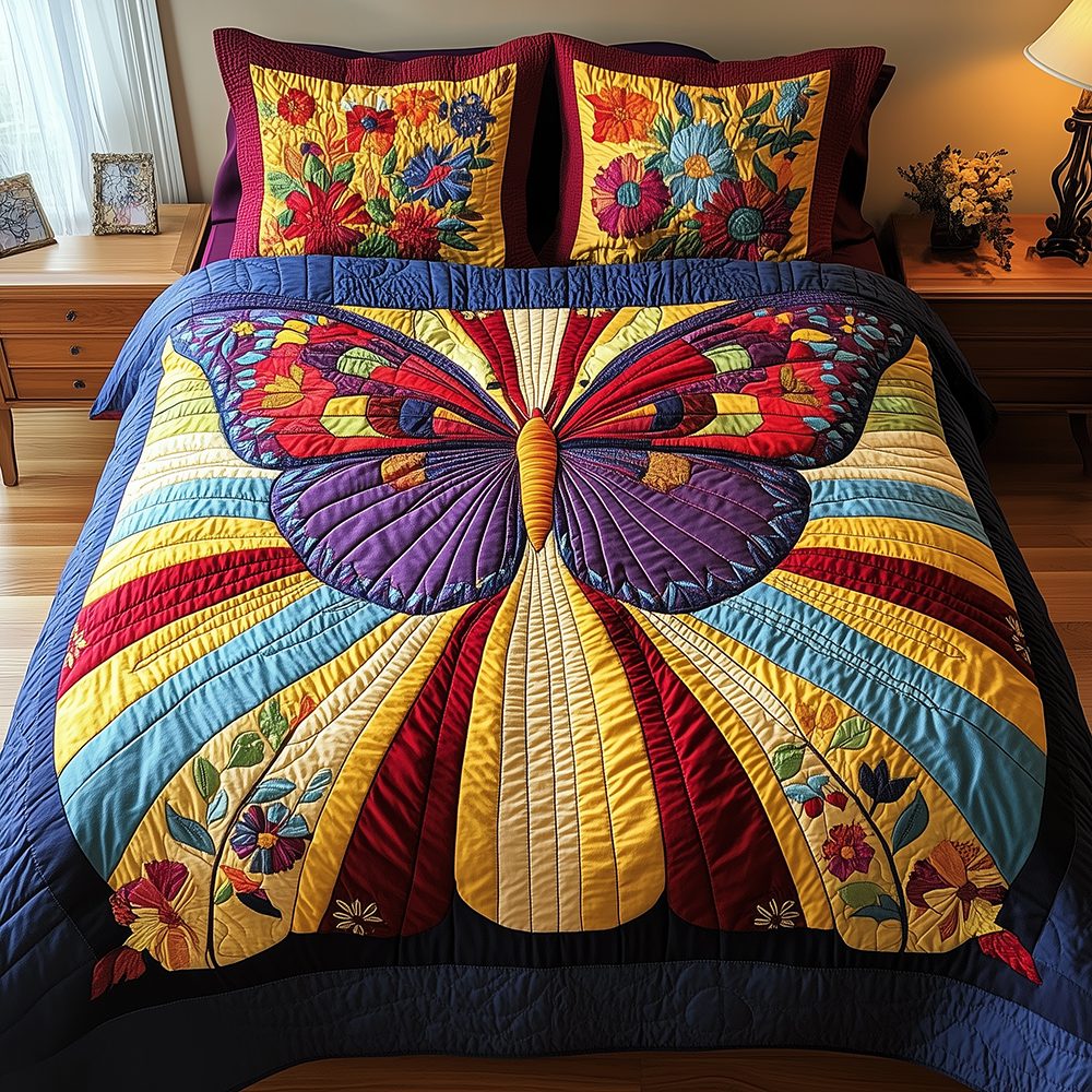 Butterfly Charm quilted 3-piece bedding set on a made bed with two matching pillow shams