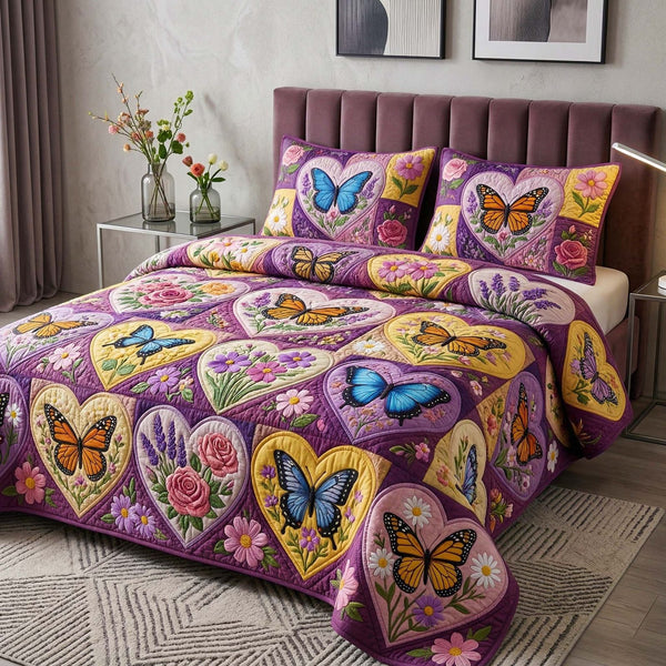 Butterfly Heart quilted 3-piece bedding set on a made bed with two matching pillow shams