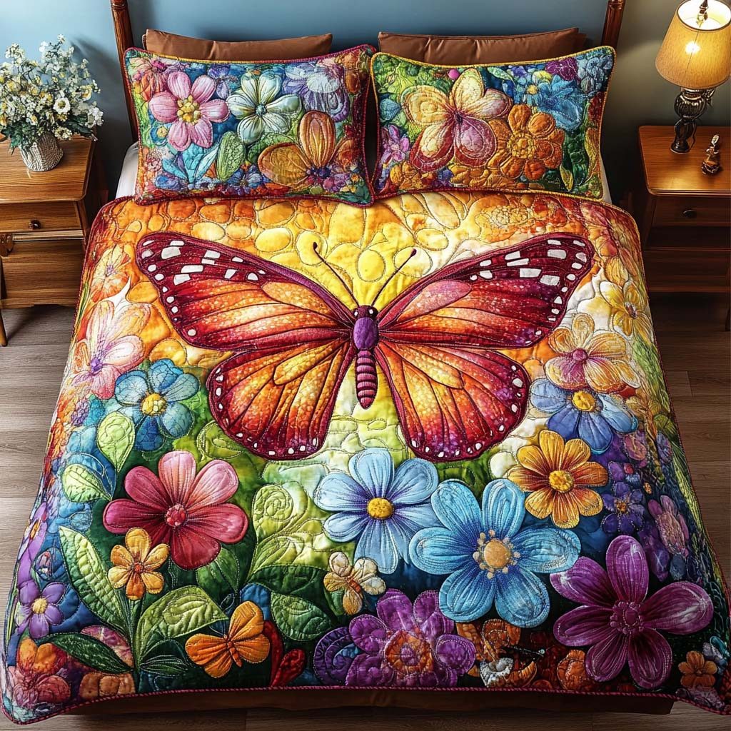 Butterfly Whispers quilted 3-piece bedding set on a made bed with two matching pillow shams