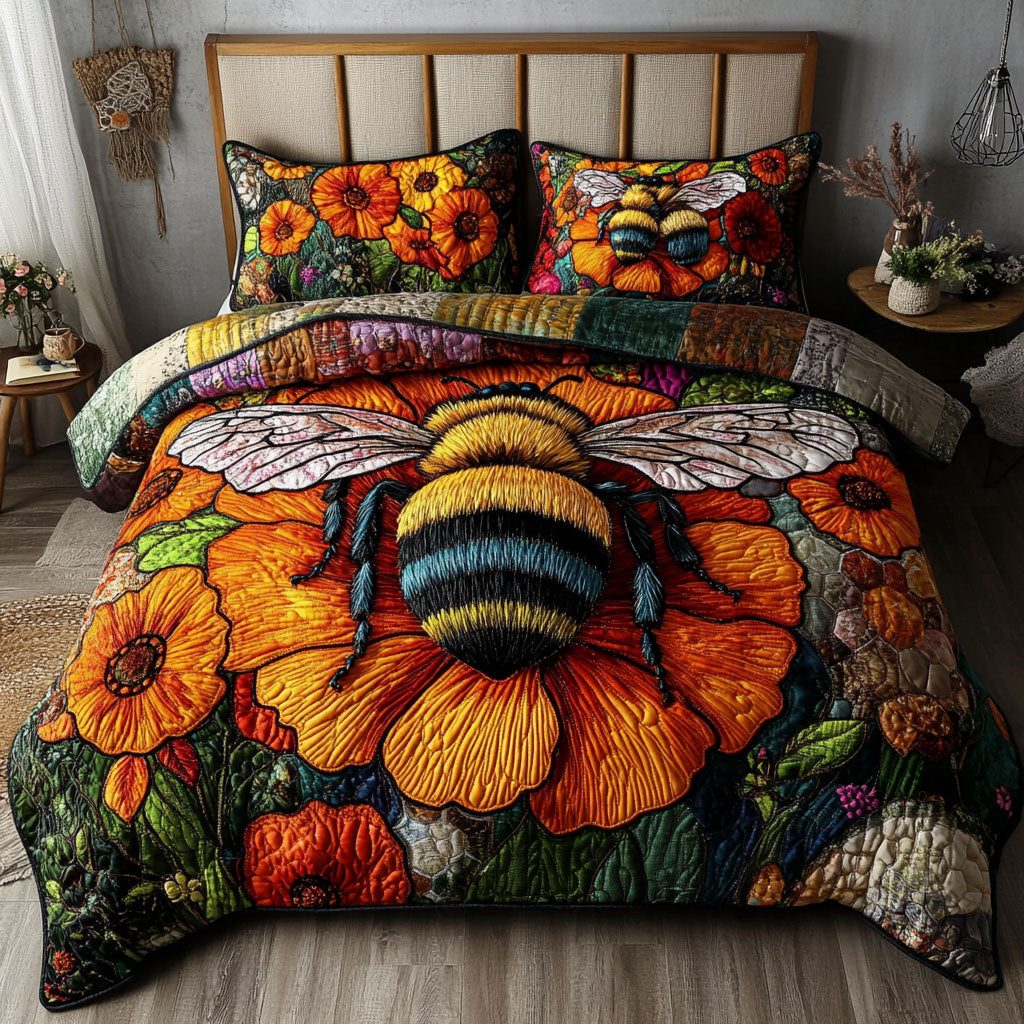 Buzzing Beauty quilted 3-piece bedding set on a made bed with two matching pillow shams