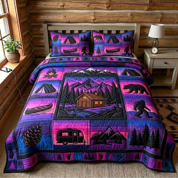 Cabin Retreat quilted 3-piece bedding set on a made bed with two matching pillow shams