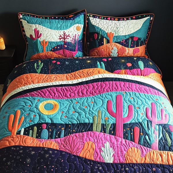 Cactus Oasis quilted 3-piece bedding set on a made bed with two matching pillow shams