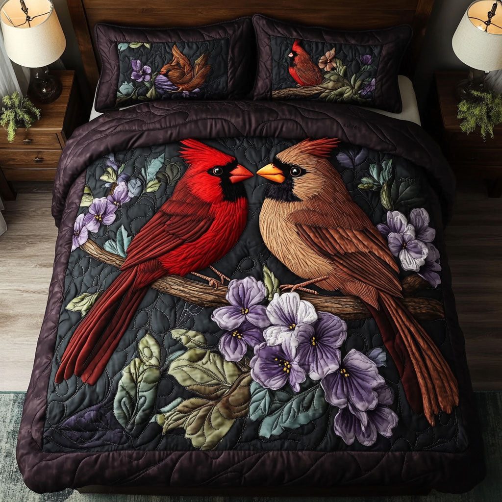 Cardinal Paradise quilted 3-piece bedding set on a made bed with two matching pillow shams
