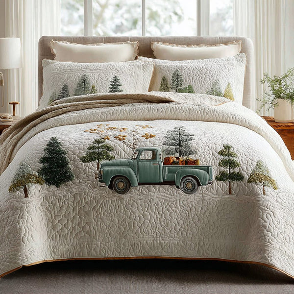 Christmas Joy quilted 3-piece bedding set on a made bed in a winter-styled bedroom