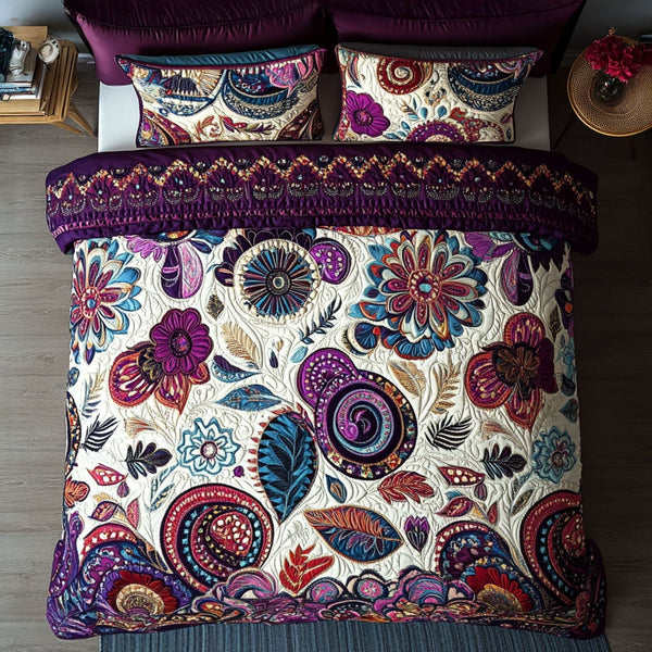 Cosmic Flow quilted 3-piece bedding set on a made bed with two matching pillow shams