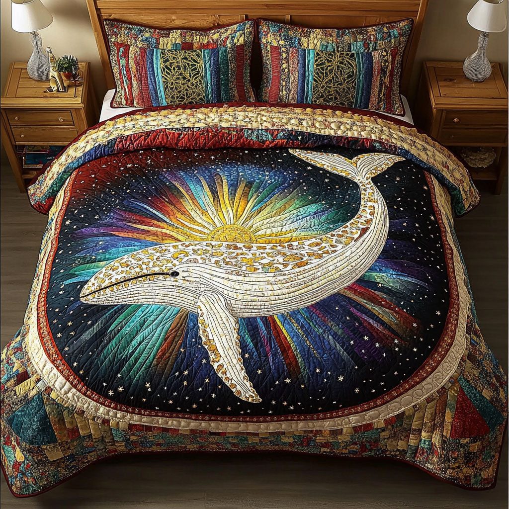 Cosmic Whale Dreams quilted 3-piece bedding set on a made bed in a light coastal bedroom