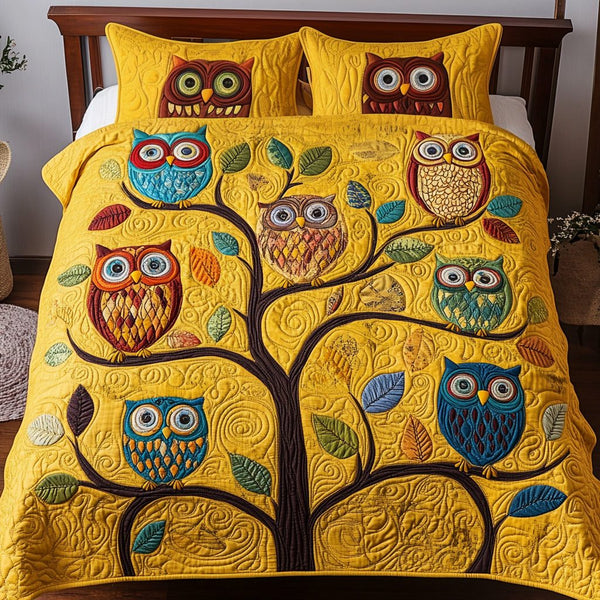 Cozy Owls quilted 3-piece bedding set on a made bed with two matching pillow shams