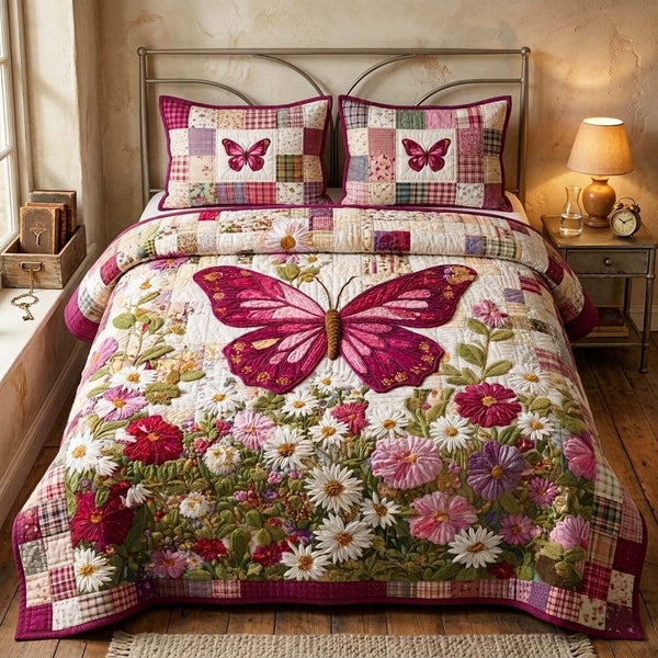 Crimson Butterfly quilted 3-piece bedding set on a made bed with two matching pillow shams
