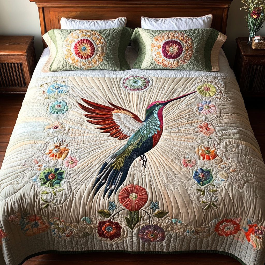 Delicate Dancer quilted 3-piece bedding set on a made bed with two matching pillow shams