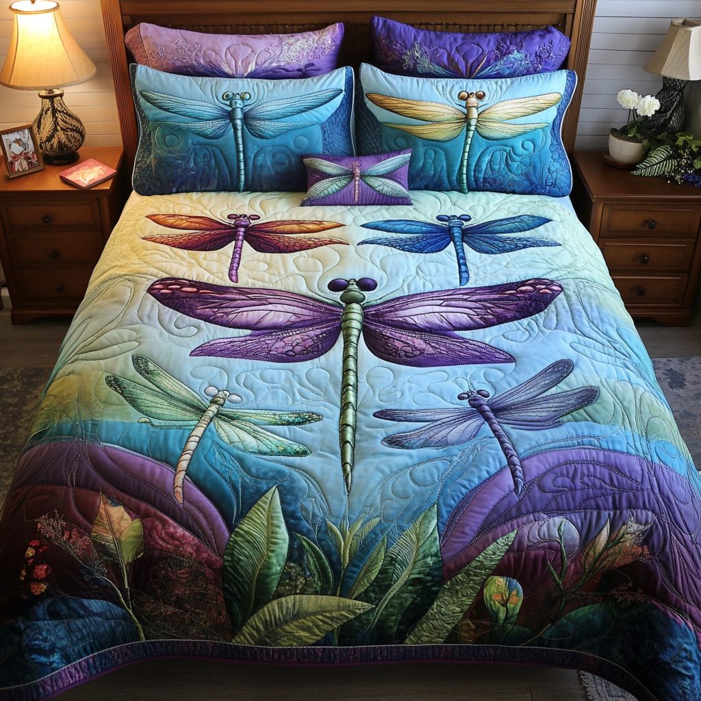 Dragonfly Delight quilted 3-piece bedding set on a made bed with two matching pillow shams