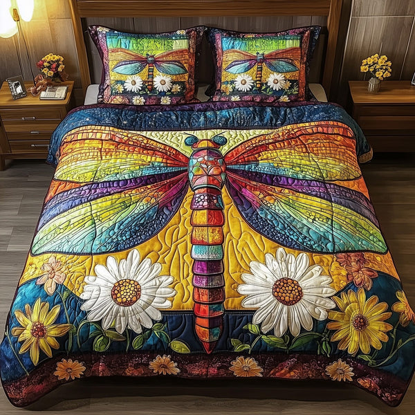 Dragonfly Dream quilted 3-piece bedding set on a made bed with two matching pillow shams
