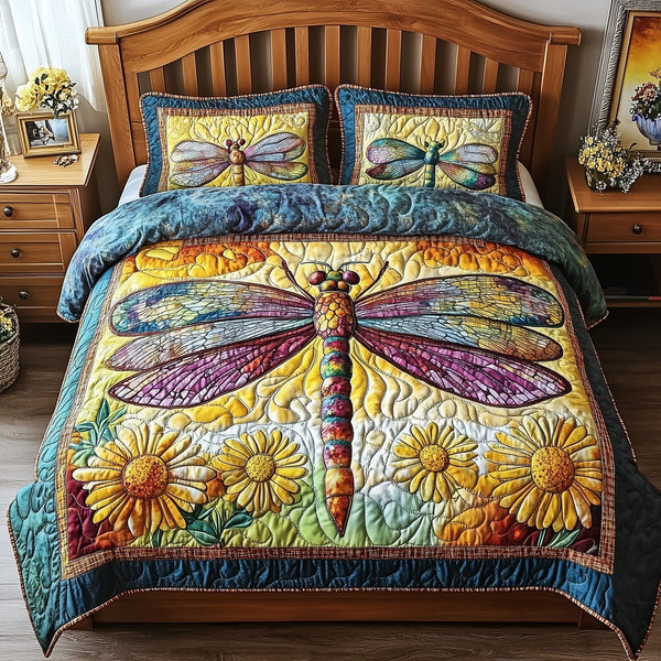 Dragonfly Dream quilted 3-piece bedding set on a made bed with two matching pillow shams