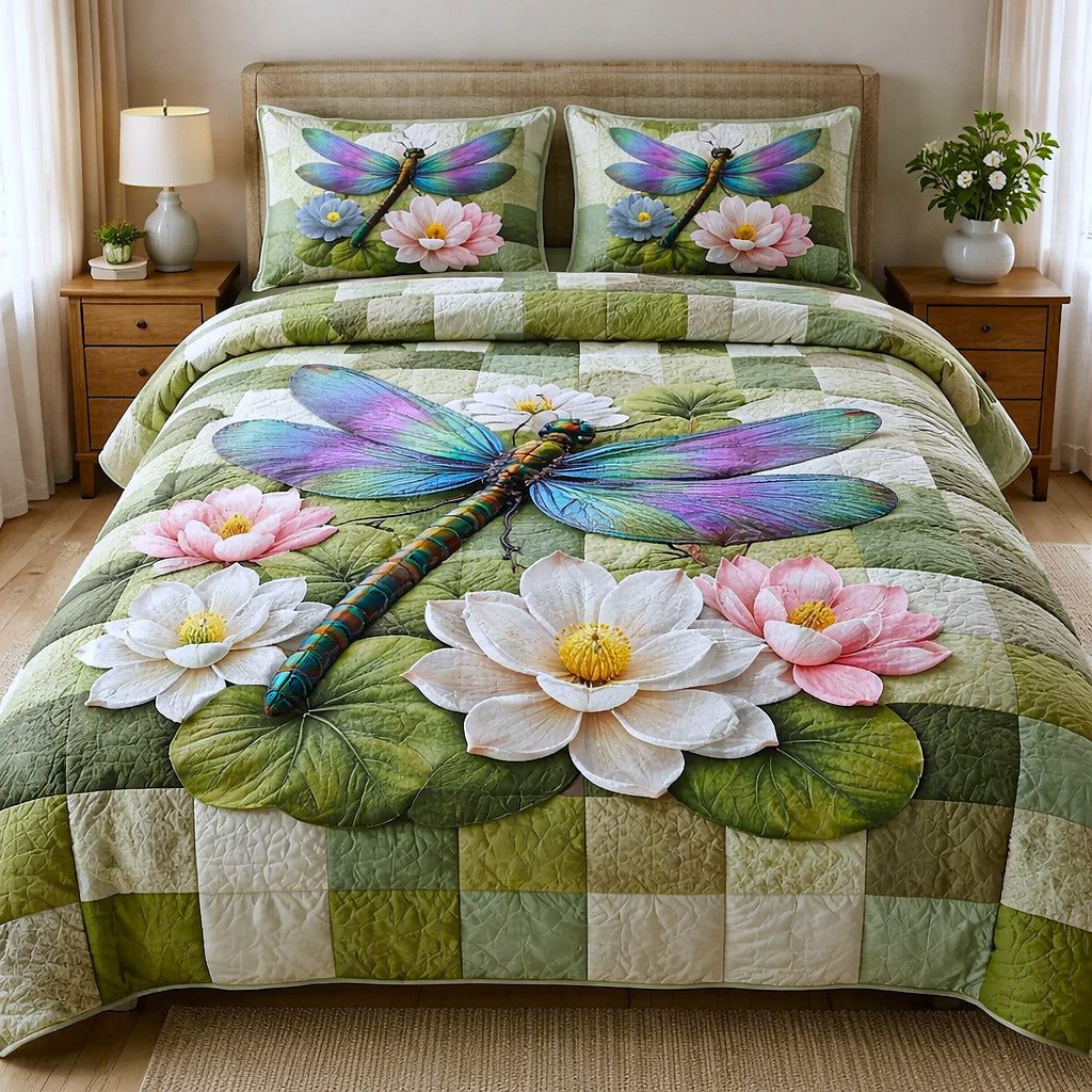 Dragonfly Glow quilted 3-piece bedding set on a made bed with two matching pillow shams