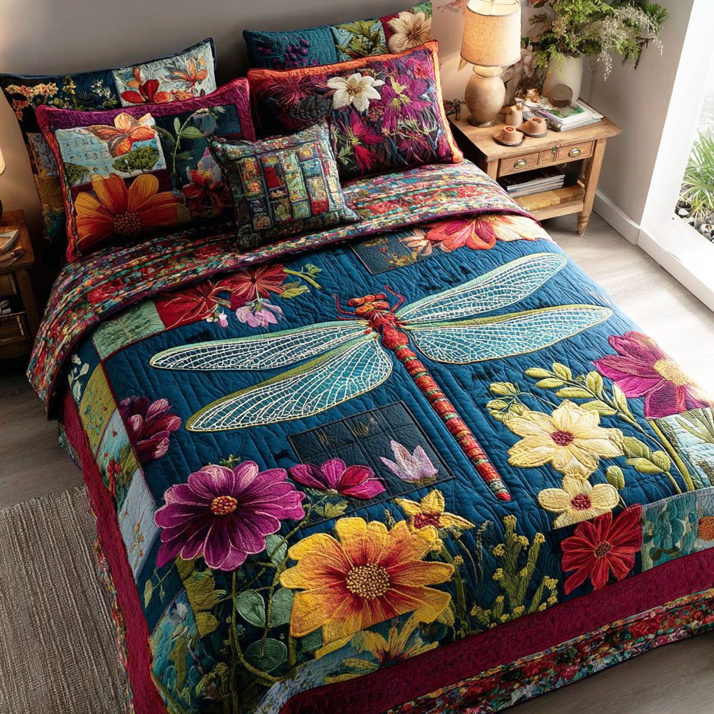 Dragonfly Petals quilted 3-piece bedding set on a made bed with two matching pillow shams