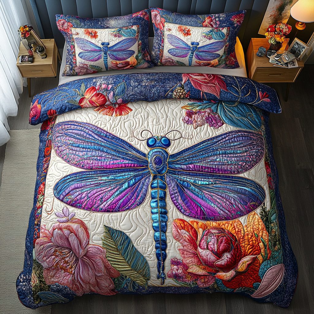 Dragonfly Sparkle quilted 3-piece bedding set on a made bed with two matching pillow shams