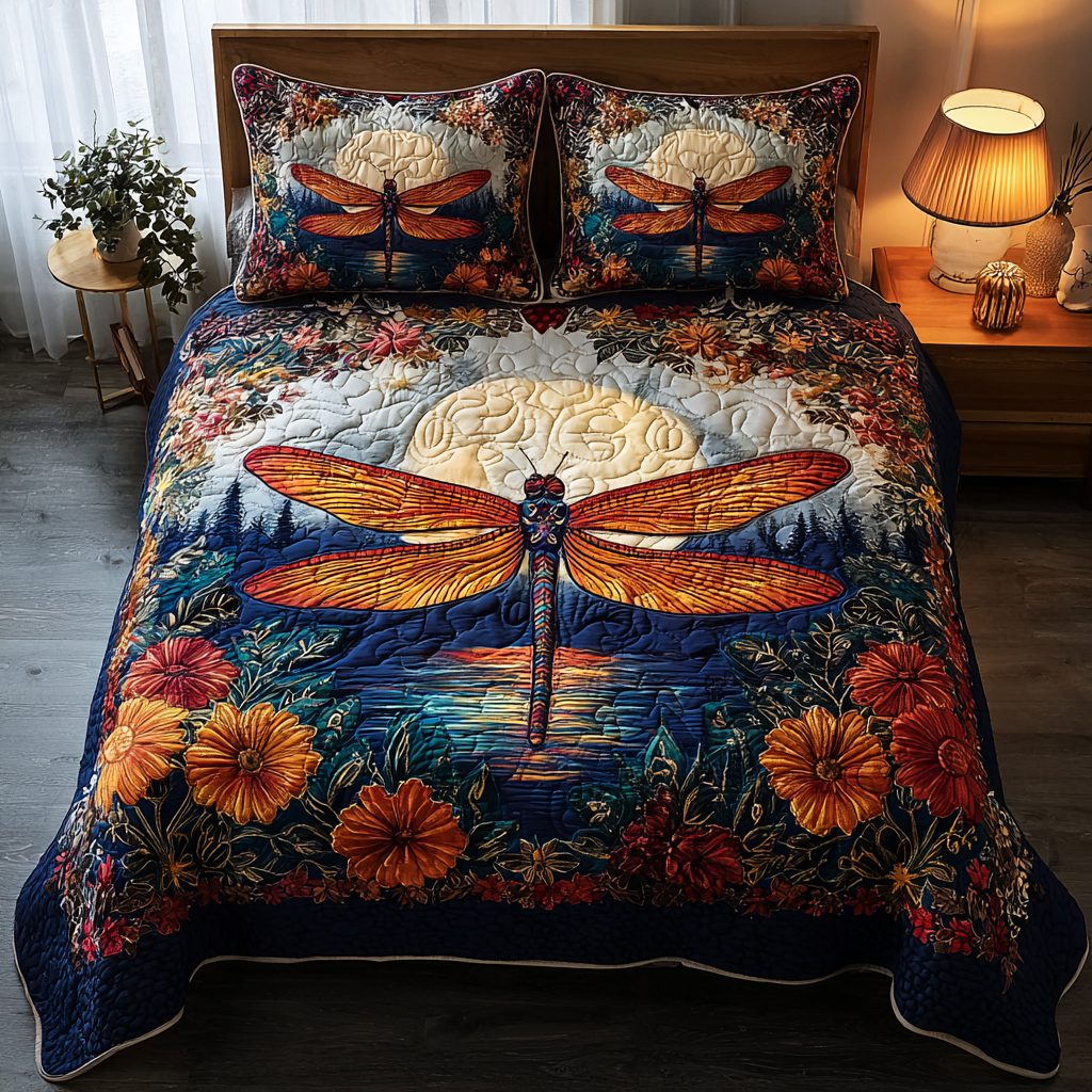 Dragonfly Whisper quilted 3-piece bedding set on a made bed with two matching pillow shams
