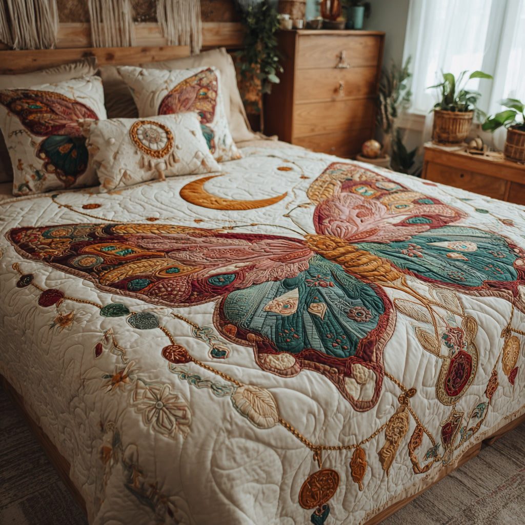 Dreamcatcher Wings quilted 3-piece bedding set on a made bed with two matching pillow shams