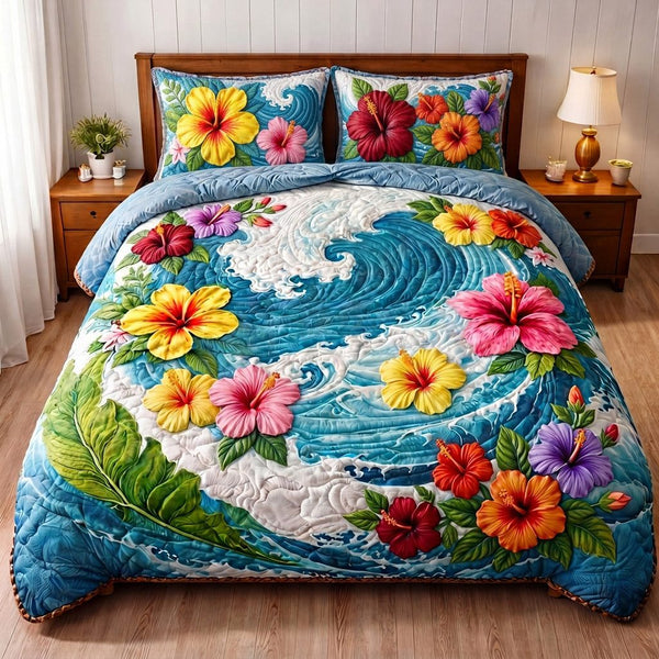 Drifting Hibiscus Waves quilted 3-piece bedding set on a made bed in a light coastal bedroom