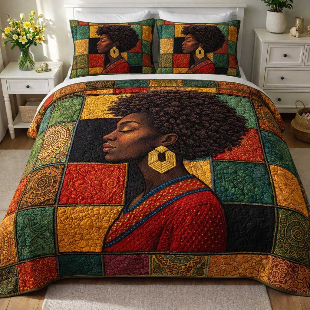 Ebony Queen quilted 3-piece bedding set on a made bed with two matching pillow shams
