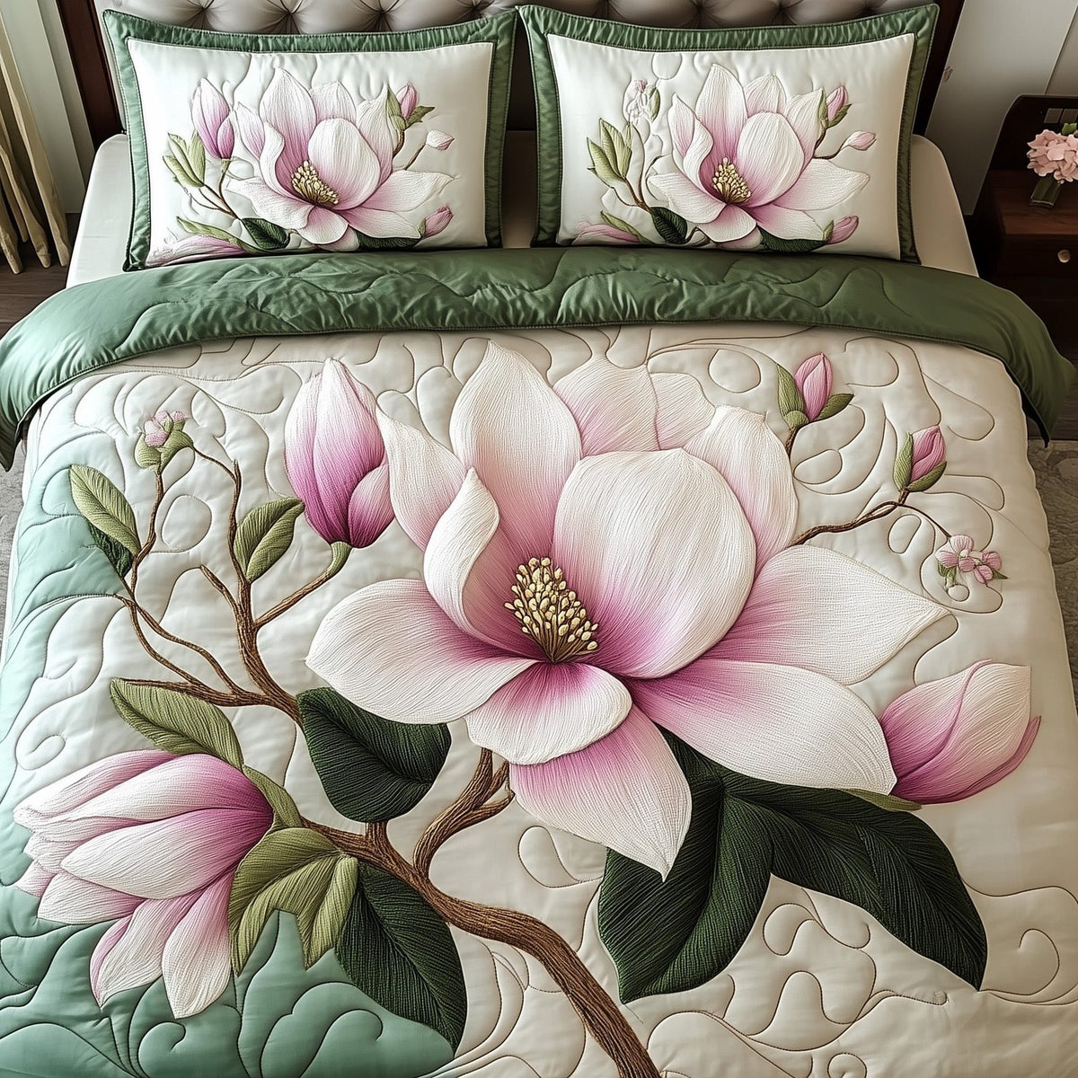 Elegant Blooming Magnolia quilted 3-piece bedding set on a made bed with two matching pillow shams