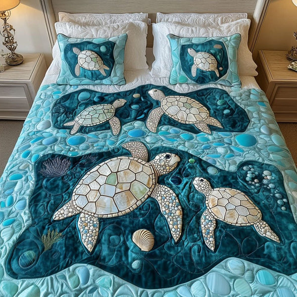 Emerald Waters quilted 3-piece bedding set on a made bed with two matching pillow shams