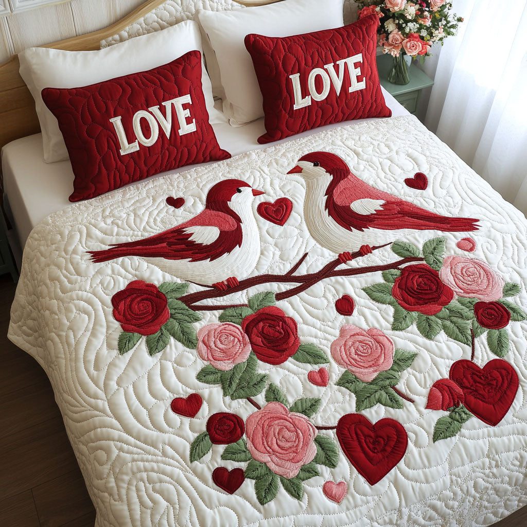 Feathered Love quilted 3-piece bedding set on a made bed with two matching pillow shams
