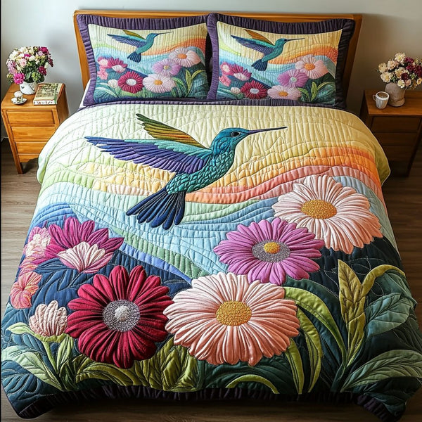 Flight of Beauty quilted 3-piece bedding set on a made bed with two matching pillow shams