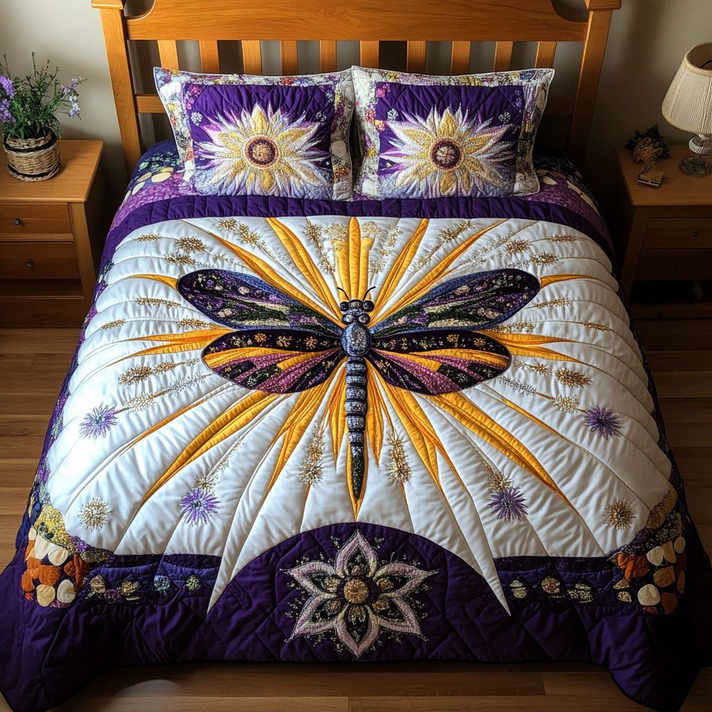 Floral Flight Dreams quilted 3-piece bedding set on a made bed with two matching pillow shams